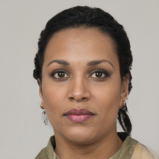 Neutral latino young-adult female with short  black hair and brown eyes