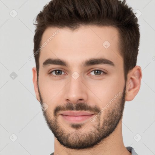 Joyful white young-adult male with short  brown hair and brown eyes