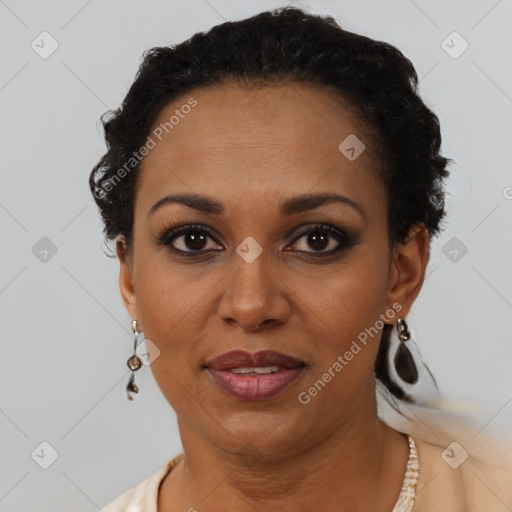 Joyful black adult female with short  black hair and brown eyes