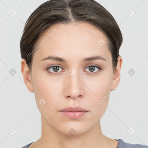 Neutral white young-adult female with short  brown hair and brown eyes