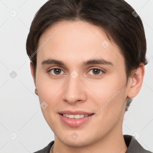 Joyful white young-adult male with short  brown hair and brown eyes