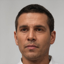 Neutral white adult male with short  black hair and brown eyes
