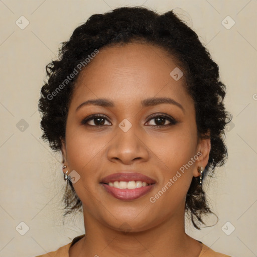 Joyful black young-adult female with long  brown hair and brown eyes