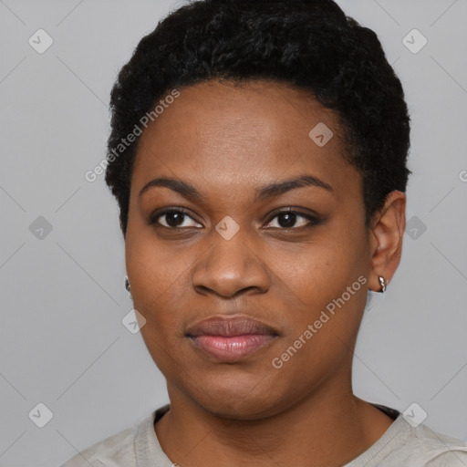 Joyful black young-adult female with short  black hair and brown eyes