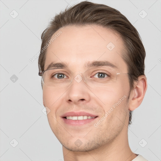 Joyful white young-adult male with short  brown hair and grey eyes