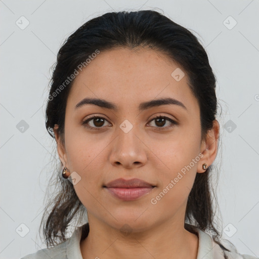 Joyful latino young-adult female with medium  brown hair and brown eyes