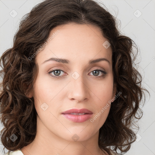 Neutral white young-adult female with long  brown hair and green eyes