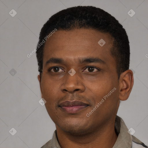 Joyful black young-adult male with short  black hair and brown eyes