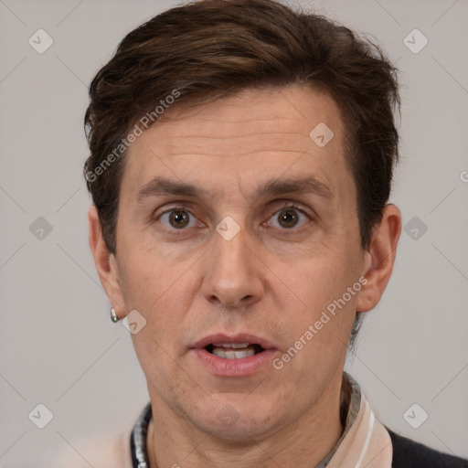 Joyful white adult male with short  brown hair and grey eyes