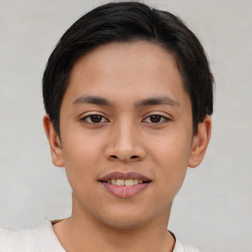 Joyful asian young-adult male with short  brown hair and brown eyes