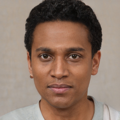 Neutral black young-adult male with short  black hair and brown eyes