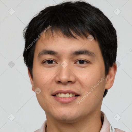 Joyful white young-adult male with short  black hair and brown eyes