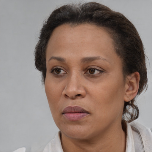 Joyful white adult female with short  brown hair and brown eyes