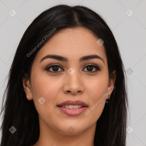 Joyful latino young-adult female with long  brown hair and brown eyes