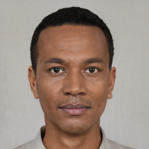 Neutral black young-adult male with short  black hair and brown eyes