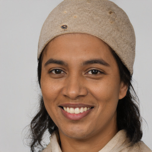 Joyful white young-adult female with medium  black hair and brown eyes