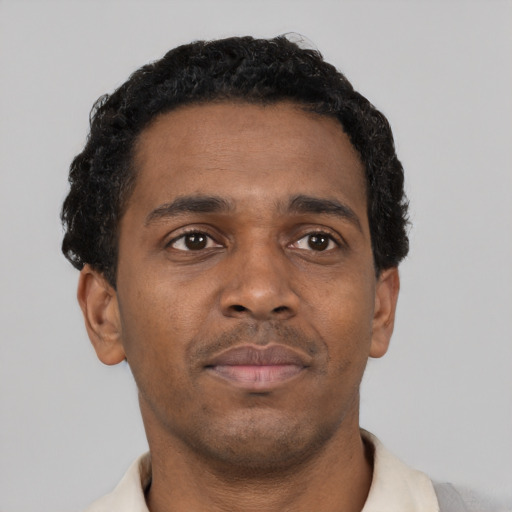 Neutral black young-adult male with short  black hair and brown eyes