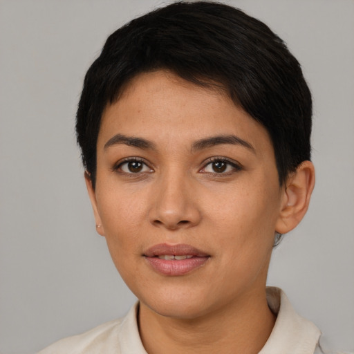 Joyful latino young-adult female with short  brown hair and brown eyes