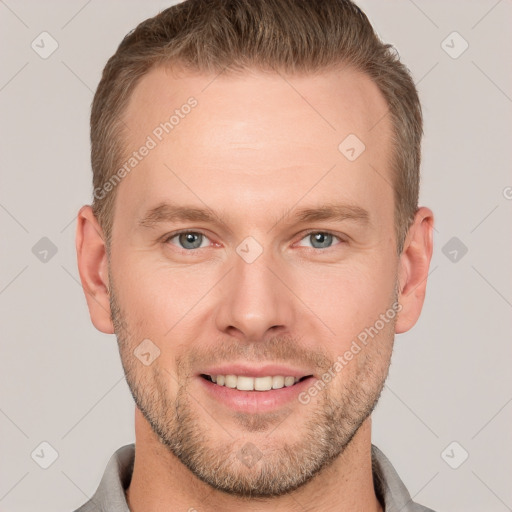 Joyful white adult male with short  brown hair and grey eyes