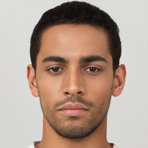 Neutral latino young-adult male with short  black hair and brown eyes