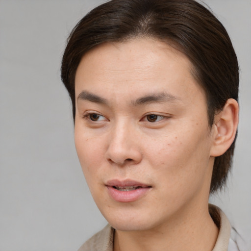 Joyful white young-adult male with medium  brown hair and brown eyes