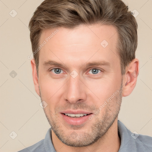 Joyful white adult male with short  brown hair and grey eyes