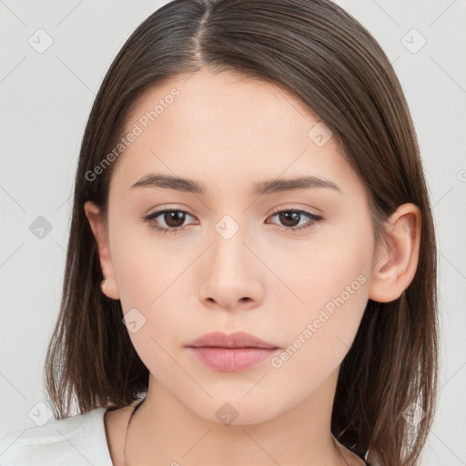 Neutral white young-adult female with long  brown hair and brown eyes