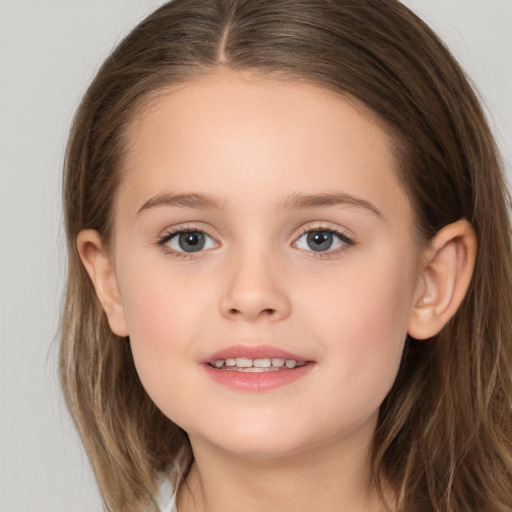 Joyful white child female with long  brown hair and brown eyes