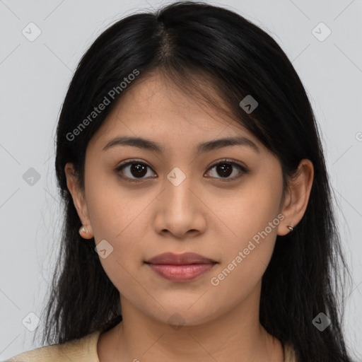 Joyful latino young-adult female with long  brown hair and brown eyes