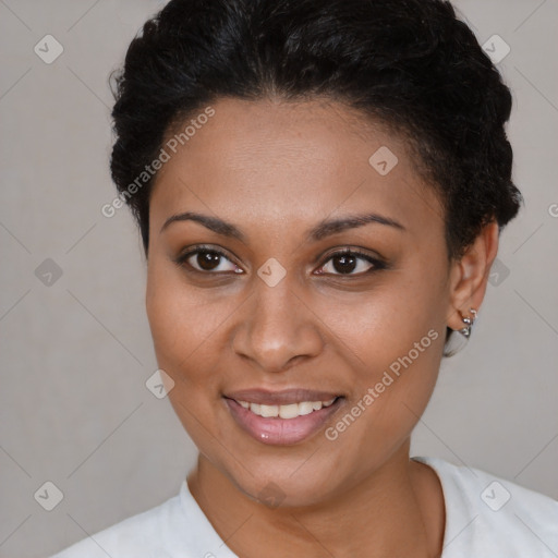 Joyful black young-adult female with short  brown hair and brown eyes