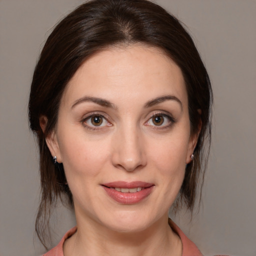 Joyful white young-adult female with medium  brown hair and brown eyes