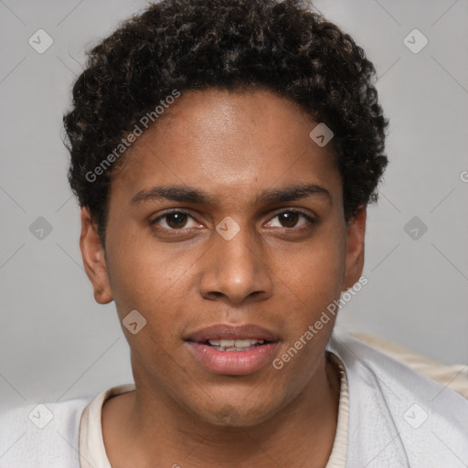 Joyful black young-adult male with short  brown hair and brown eyes