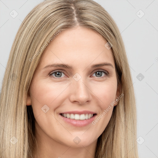 Joyful white young-adult female with long  brown hair and grey eyes