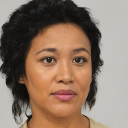 Joyful asian adult female with medium  brown hair and brown eyes