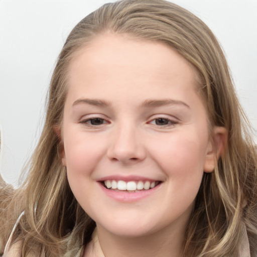 Joyful white child female with long  brown hair and blue eyes