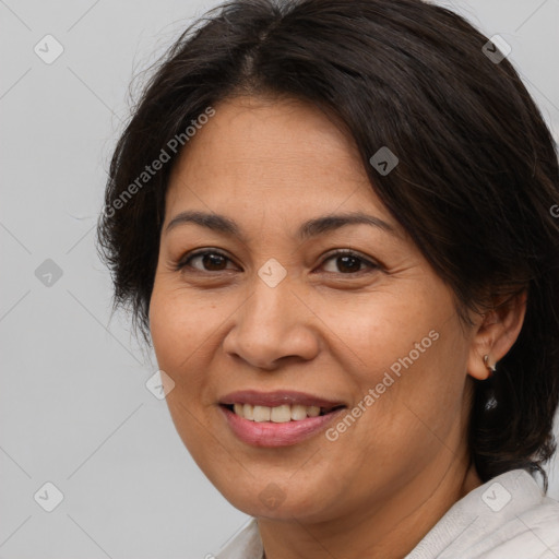 Joyful white adult female with medium  brown hair and brown eyes