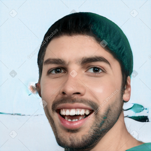 Joyful white young-adult male with short  black hair and brown eyes