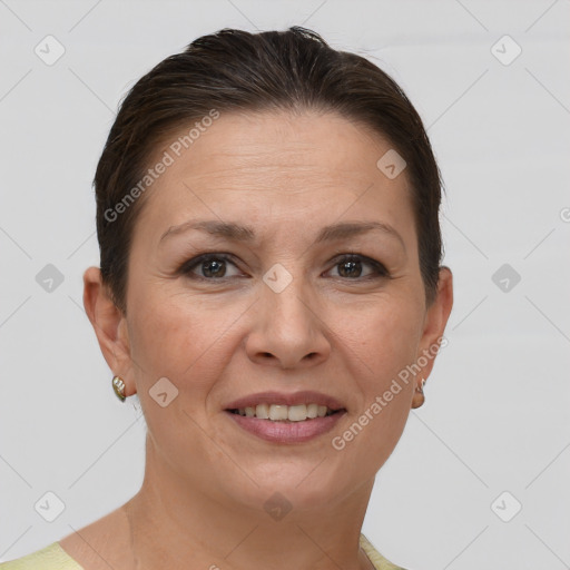 Joyful white adult female with short  brown hair and brown eyes