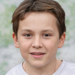 Joyful white child male with short  brown hair and brown eyes