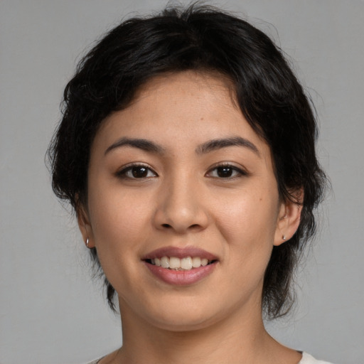 Joyful asian young-adult female with medium  brown hair and brown eyes
