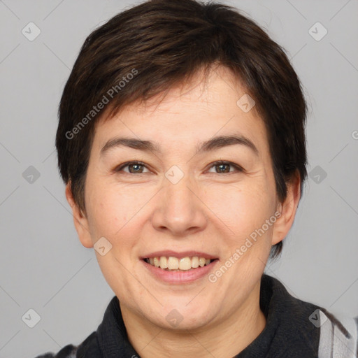 Joyful white adult female with short  brown hair and brown eyes