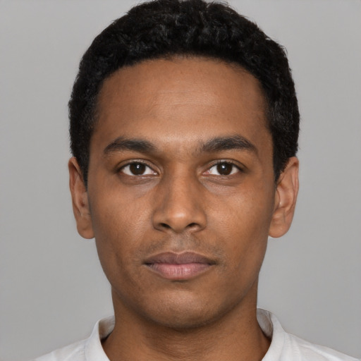 Neutral black young-adult male with short  black hair and brown eyes