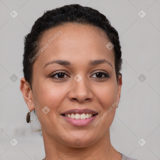 Joyful black young-adult female with short  brown hair and brown eyes