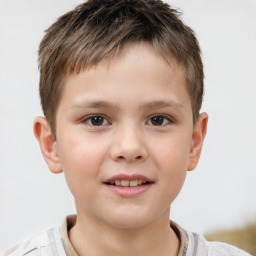 Joyful white child male with short  brown hair and brown eyes