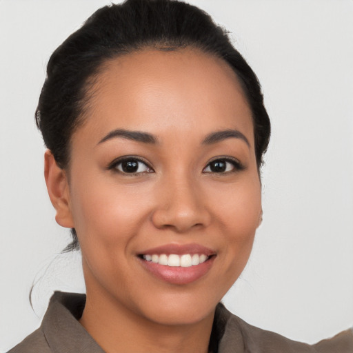 Joyful white young-adult female with short  black hair and brown eyes