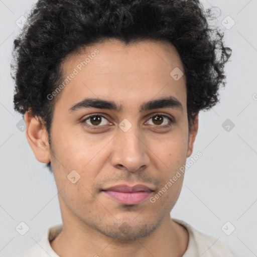 Joyful latino young-adult male with short  brown hair and brown eyes