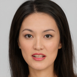 Joyful asian young-adult female with long  brown hair and brown eyes