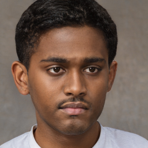 Neutral black young-adult male with short  brown hair and brown eyes