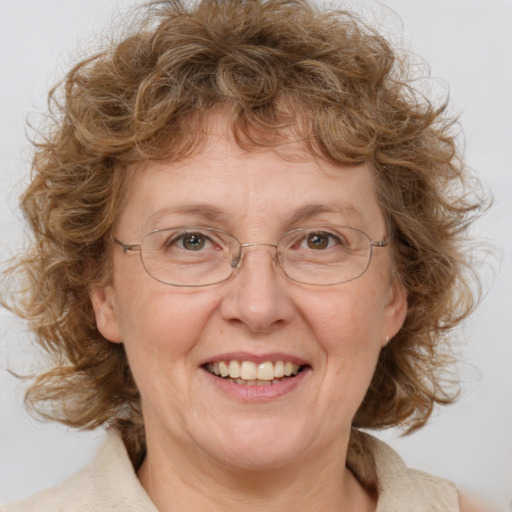 Joyful white middle-aged female with medium  brown hair and blue eyes