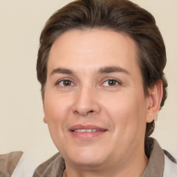 Joyful white adult male with medium  brown hair and brown eyes